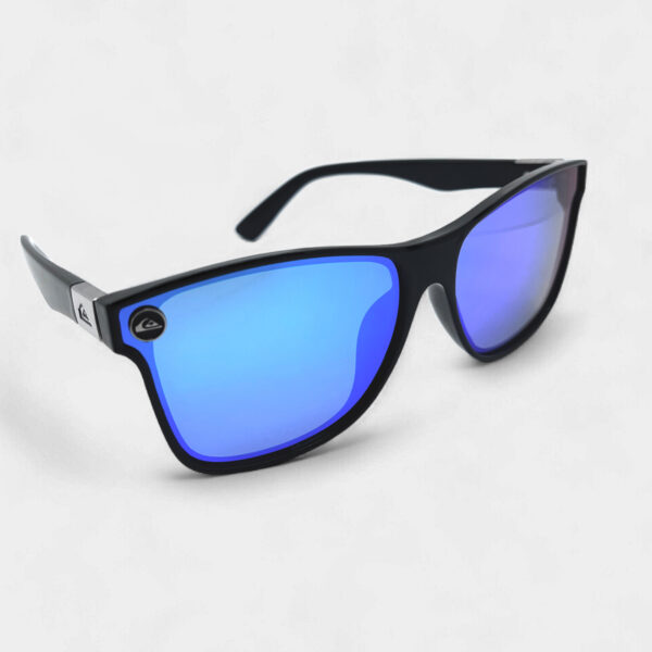 Angled front view of the Quiksilver 'Colour Block' Square sunglasses, highlighting the translucent blue frame front, black temples, and the bright blue mirror lens.