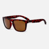 Angled view of the Quiksilver QS220 Classic Square sunglasses, highlighting the vibrant red tortoiseshell frame and the brown tinted lens.