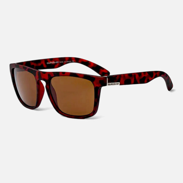 Angled view of the Quiksilver QS220 Classic Square sunglasses, highlighting the vibrant red tortoiseshell frame and the brown tinted lens.