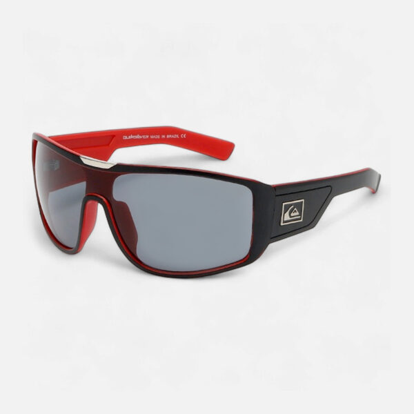 Angled view of the Quiksilver QS234 Polarized Sport Wrap Shield sunglasses, showcasing the matte black frame, subtle red accents, and the dark smoke polarized shield lens.