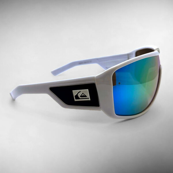 Right side view of the Quiksilver QS238 Sport Wrap Shield sunglasses, showing the profile of the solid white frame and the full-coverage rainbow mirror shield lens.