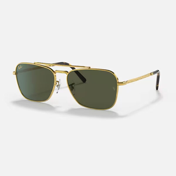 Angled view of the Ray-Ban New Caravan RB3636 sunglasses, highlighting the sleek gold metal frame and the classic G-15 green polarized squared lenses.