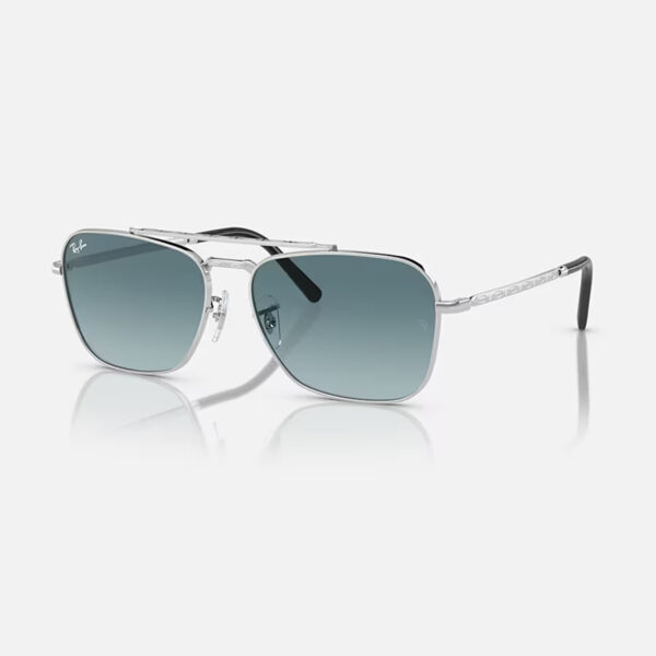 Ray-Ban RB3636 New Caravan sunglasses in silver with light blue gradient lenses, angled studio shot on white background.